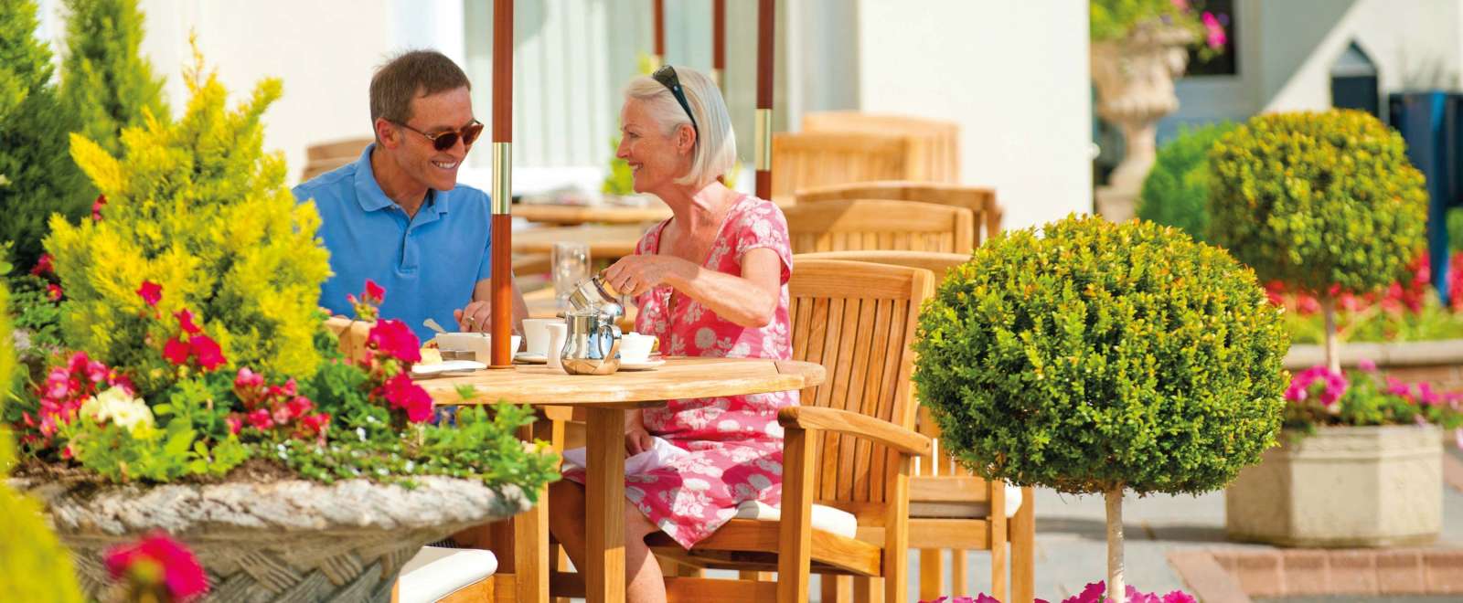 Imperial Hotel Couple Enjoying Tea at the Outside Seating Area