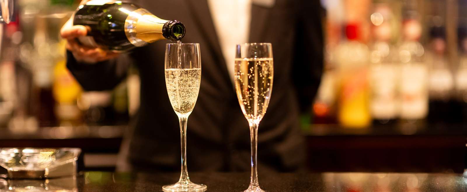 Sayed Bar Staff Pouring Champagne on Glasses