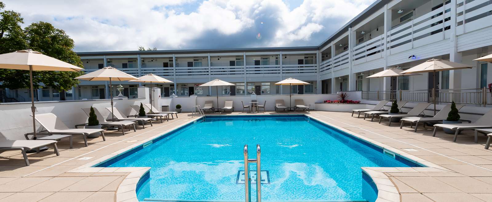 The outdoor swimming pool and sun loungers at the Barnstaple Hotel