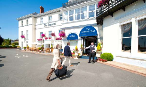 Imperial Hotel Arriving Couple Greeted at Hotel Entrance Archway