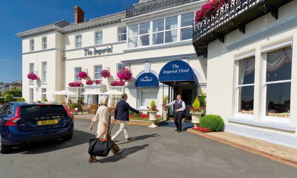 Imperial Hotel Arriving Couple Greeted at Hotel Entrance Archway