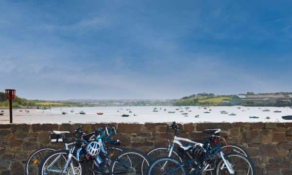 Bikes Leaning on Wall with a View Over the Estuary at Instow North Devon
