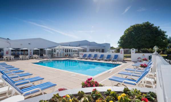 The outdoor swimming pool and sun loungers at the Barnstaple Hotel