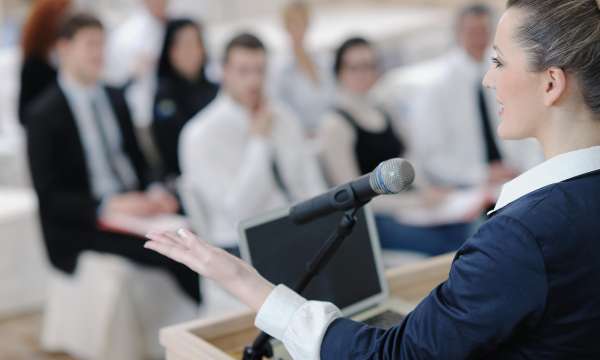 Woman Speaking at Business Meeting concept 
