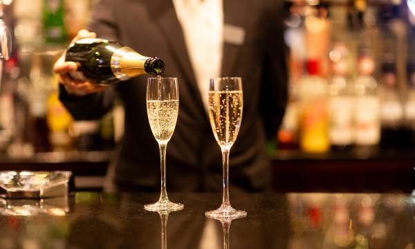 Sayed Bar Staff Pouring Champagne on Glasses