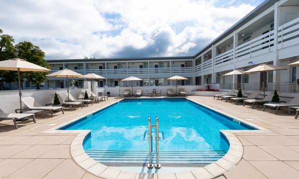The outdoor swimming pool and sun loungers at the Barnstaple Hotel