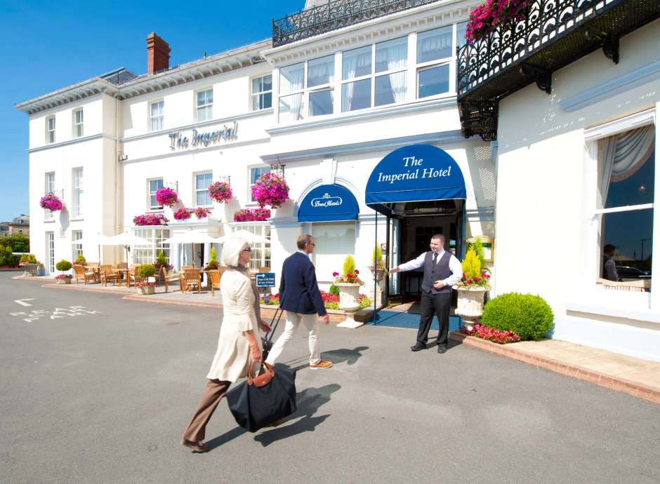 Imperial Hotel Arriving Couple Greeted at Hotel Entrance Archway