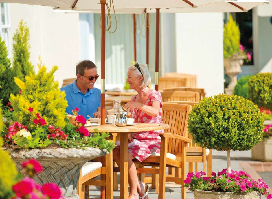 Imperial Hotel Couple Enjoying Tea at the Outside Seating Area