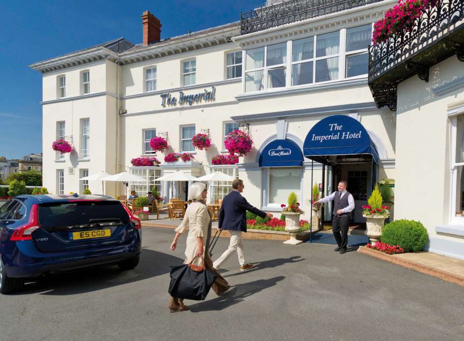 Imperial Hotel Arriving Couple Greeted at Hotel Entrance Archway