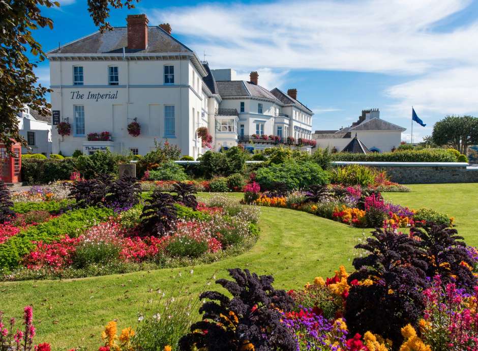 Imperial Hotel Exterior View with Flower Beds