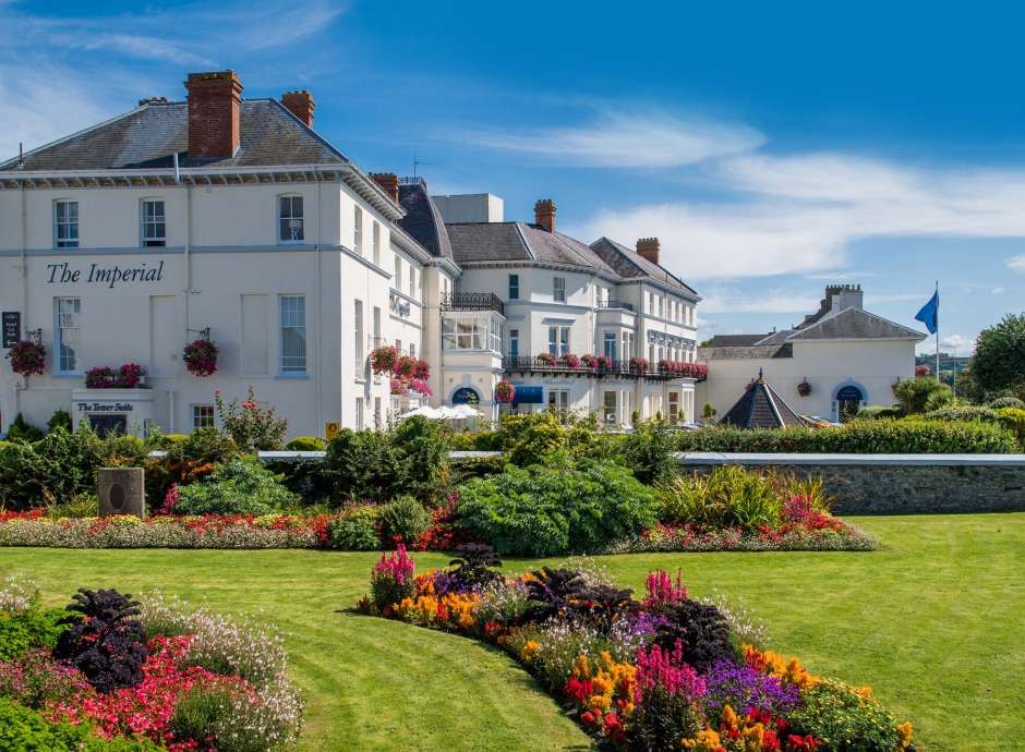 Imperial Hotel Exterior View with Flower Beds