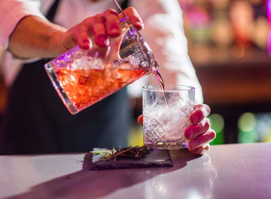 A bartender making smoking cocktails at Bar62 in barnstaple