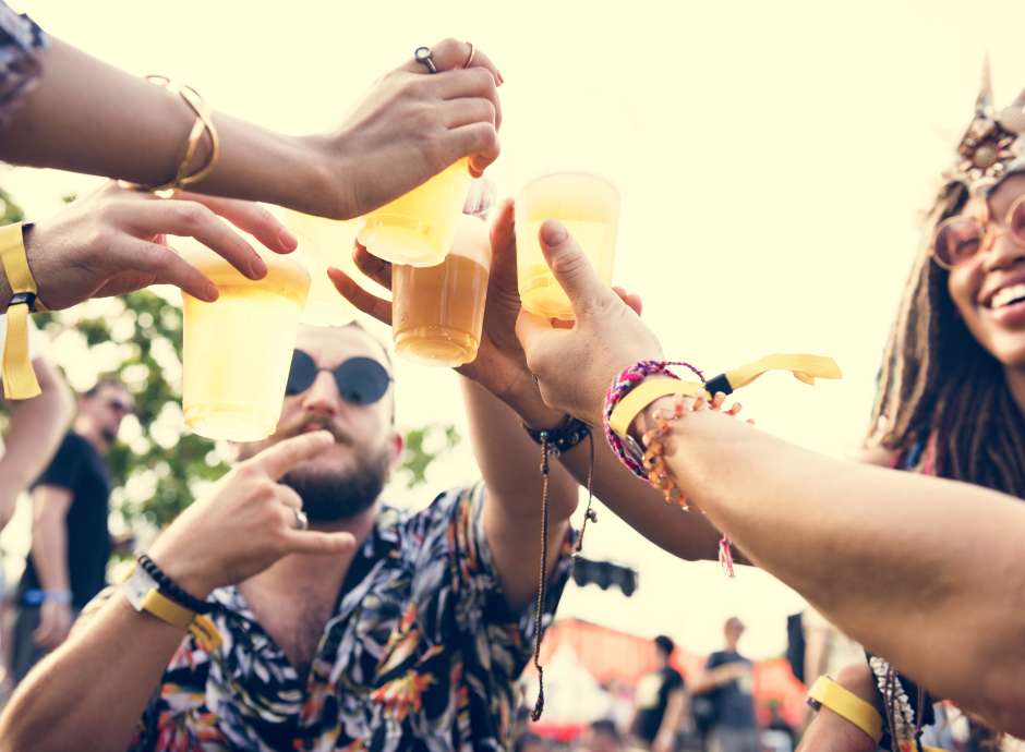Group of Friends having a drink at festival